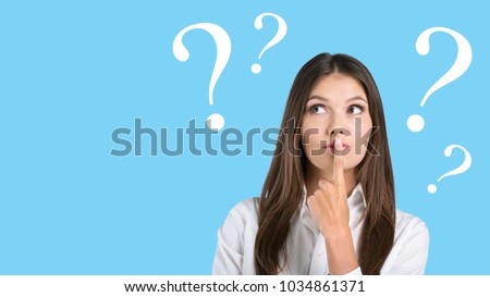 Young woman with question marks