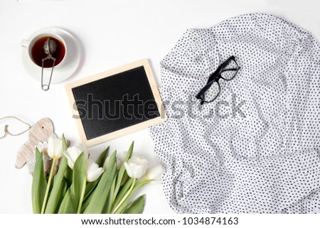 Tulip with blank picture frame on white background