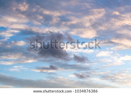 Colorful dawn/dusk sky, with dark clouds background.