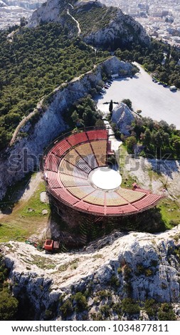 Aerial drone photo of open air theatre on top of Lycabettus hill with views of city of Athens, Greece.