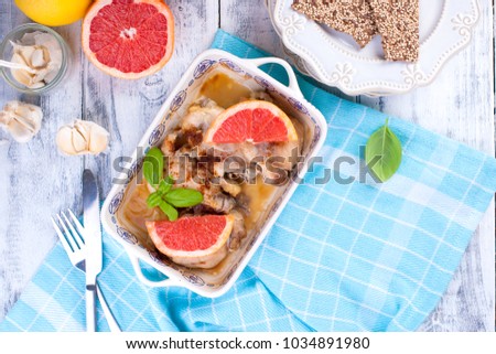 Chicken fillet with grapefruit baked in the oven. Beautiful dishes with a picture. Useful dinner. Tasty food.