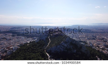 Aerial birds eye view photo taken by drone of Lycabettus hill, Athens historic center, Attica, Greece