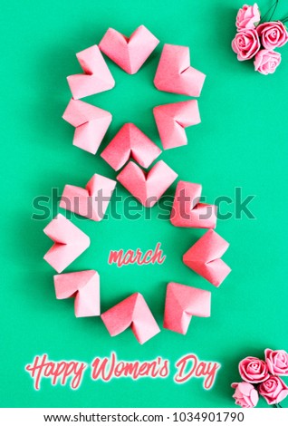 Happy International Women’s Day celebrate on March 8, congratulatory CARD. rose-color paper hearts shape figure eight 8 on white background