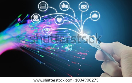 Internet of things (IoT) concept.working with social connection media concept.network cables closeup with fiber optical background Royalty-Free Stock Photo #1034908273