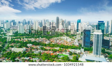 Aerial view of beautiful Jakarta downtown under blue sky at morning time