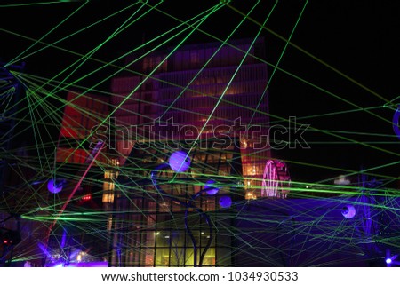 Montreal Festival of Lights. Colorful illuminated silhouettes in the night. lighting installations. Winter festival of arts. Outdoor family activities. Entertainment District.

