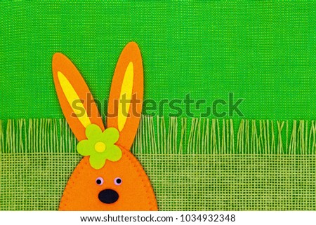Decorative Easter Orange Rabbit on green runner. Easter background  with Bunny 