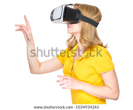 Happy woman wearing virtual reality goggles watching movies or playing video games, isolated on white background. Smiling female looking in VR glasses and gesturing with hands.