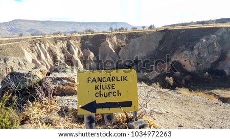 Desert old road sign "pancarlic kilise church load direction sign"