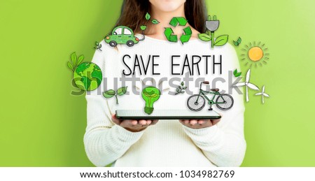 Save Earth with woman holding a tablet computer