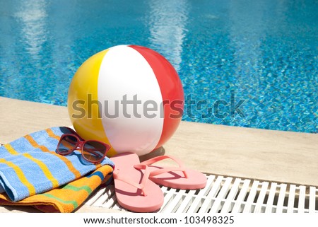 Summer vacation accessories  by the swimming pool