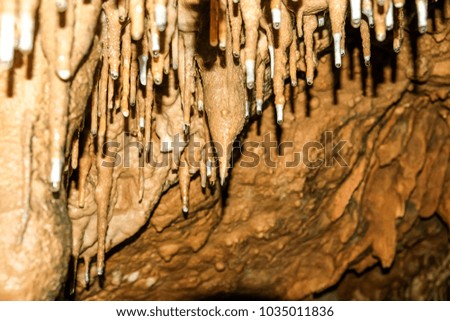 Stalactites and stalagmites in the cave in Southern Thailand.
