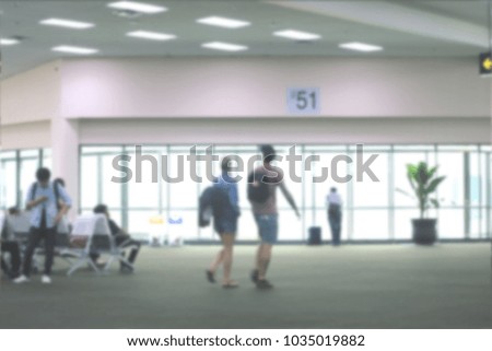 Blurred vision of people walking at the airport to travel