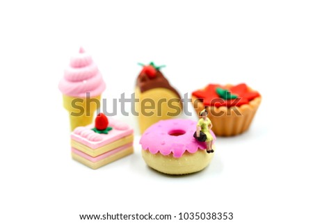 Miniature people : woman sitting with  dessert,fun and food concept.