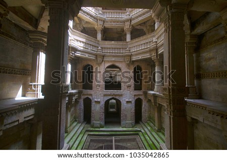 Inner view of Adalaj Ni Vav (Stepwell), or Rudabai Stepwell. Built in 1498  is intricately carved and is five stories deep. Ahmedabad, Gujarat, India Royalty-Free Stock Photo #1035042865
