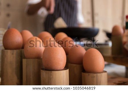 Raw egg stand on table in kitchen prepare to make breakfast with chef