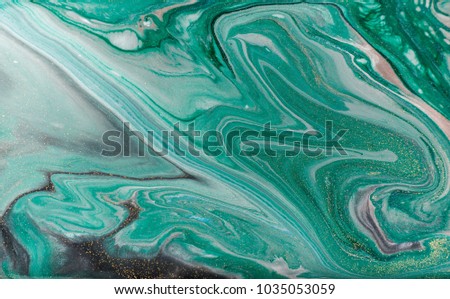 Marble abstract acrylic background. Nature green marbling artwork texture. Golden glitter. Royalty-Free Stock Photo #1035053059
