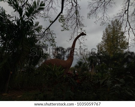 silhouette Dinosaur  in forest ,take a picture from public park Sakon Nakhon province,Thailand