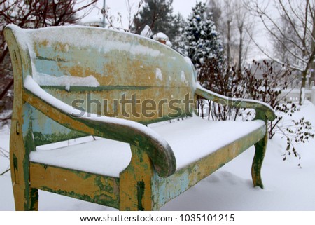 Vintage wood bench in winter garden. Ligneous furniture for terrace. Cozy secluded corner, picturesque place of pleasure ground. Chrismas story. Noble Nest of 19th century Russia.