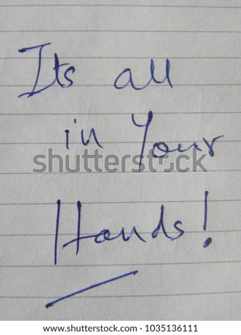 Text Its all in your hands hand written by blue pen on notebook paper