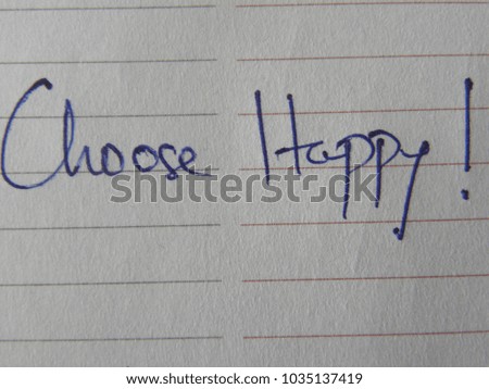 Text Choose Happy hand written by blue pen on notebook paper