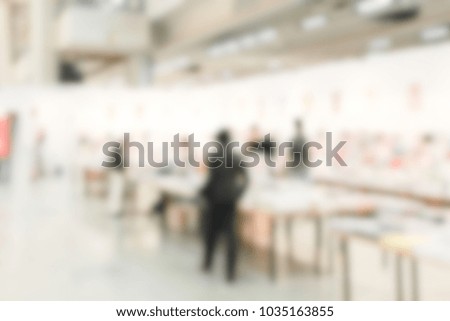 View of a trade show location. Background with an intentional blur effect applied.