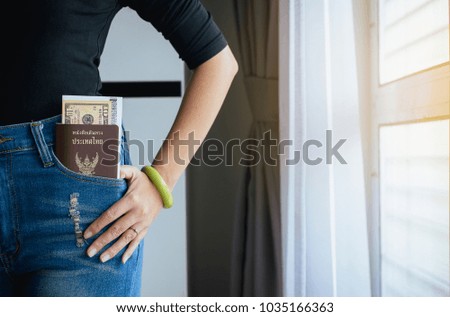 Passport and US dollar,Boarding pass in trousers pocket,Travel Vacation Concepts