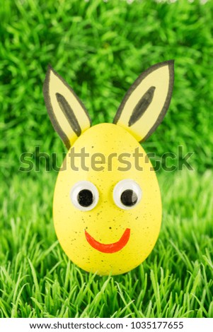 Yellow Easter egg with bunny ears