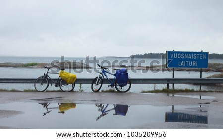 Two bicycles are waiting for ferries to Aland Islands in Osnas in Finland Royalty-Free Stock Photo #1035209956