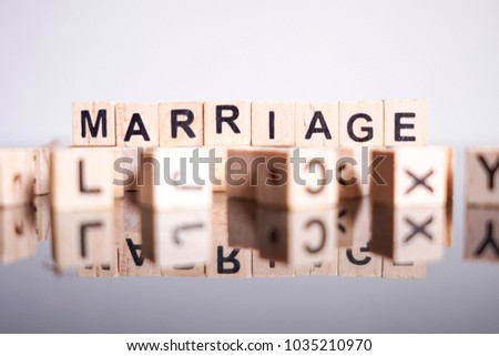 Marriage word cube on reflection