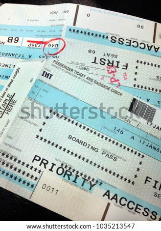Generic First Class Priority Access stamped boarding passes issued in the USA.