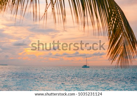 Luxury yacht in tropical sunset sea and under colorful sky. Relaxing recreational and sport background