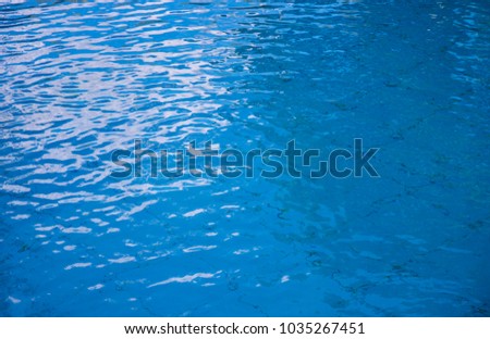 Blue water surface background. Rippled water texture. Swimming pool surface. Breezy swimming pool. Fresh clean water texture. Blue ocean view. Fresh water of lake. Relaxing summer photo wallpaper