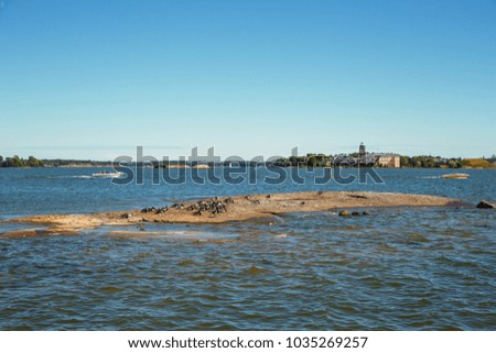 Small islands on the horizon in the sea with view from Helsinki, Finland