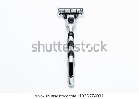 man's razor on a white background. Close-up. Royalty-Free Stock Photo #1035276091