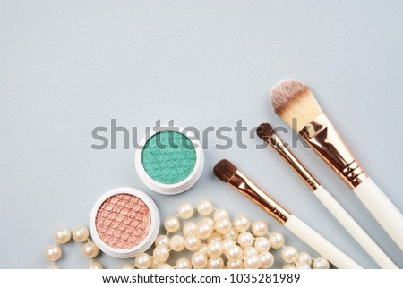 fashion background, makeup brushes, eye shadow                               