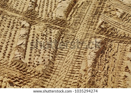 Tread Tire Marks Pattern From Off-Road Vehicles On The Sand Dunes In The Sandy Desert, Isolated Horizontal Background Or Texture, Adventure Or Trophy Concept
