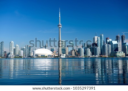 Toronto city skyline on clear sunny day.