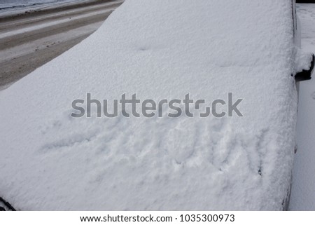 Snow sign on the car