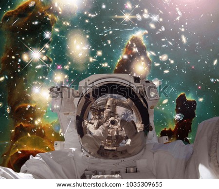 Astronaut in outer space. The elements of this image furnished by NASA.
