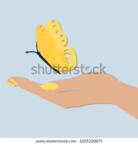 women's hand holding a butterfly