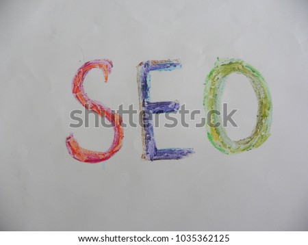 Text SEO hand written by colorful oil pastels on white color paper