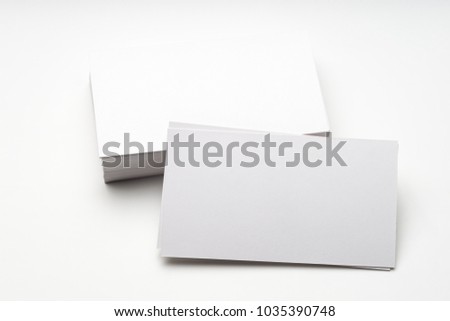Photo of blank business cards on a wooden background. Template for ID.