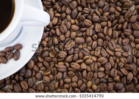 coffee Cup and coffee beans on burlap