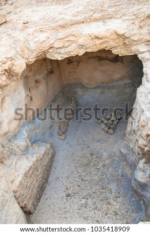 Vertical picture of old cistern found at the fortress in Massada, Israel