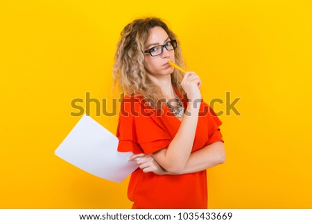 Woman in dress with blank paper and pencil