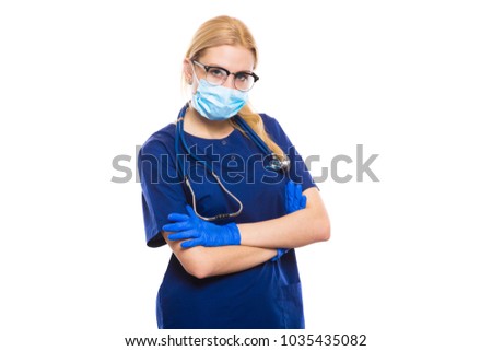 Woman doctor in scrubs and gloves with face mask