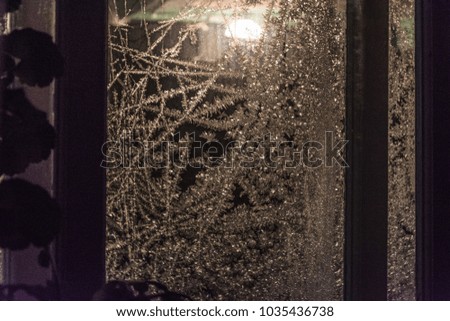 Frosty ice glass window texture, winter night