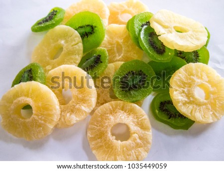candied slices of kiwi and pineapple