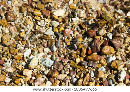 small rock and sand on the beach